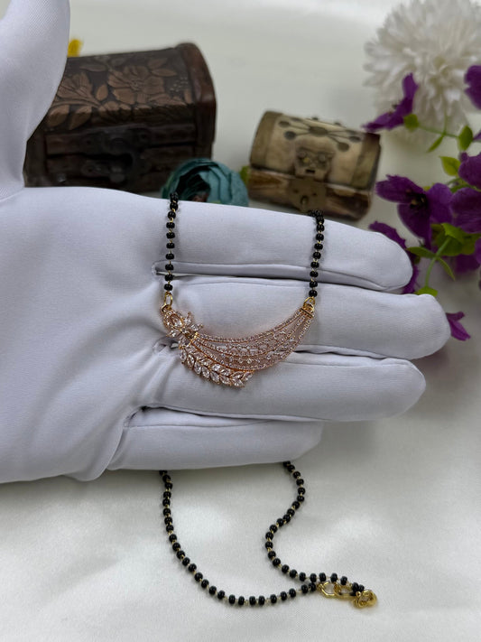 White Mangalsutra detail shot showing intricate work