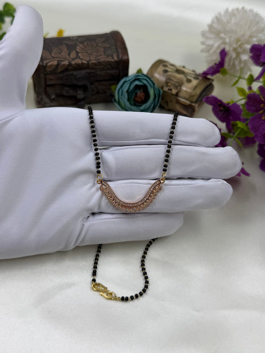White Mangalsutra detail shot showing intricate work