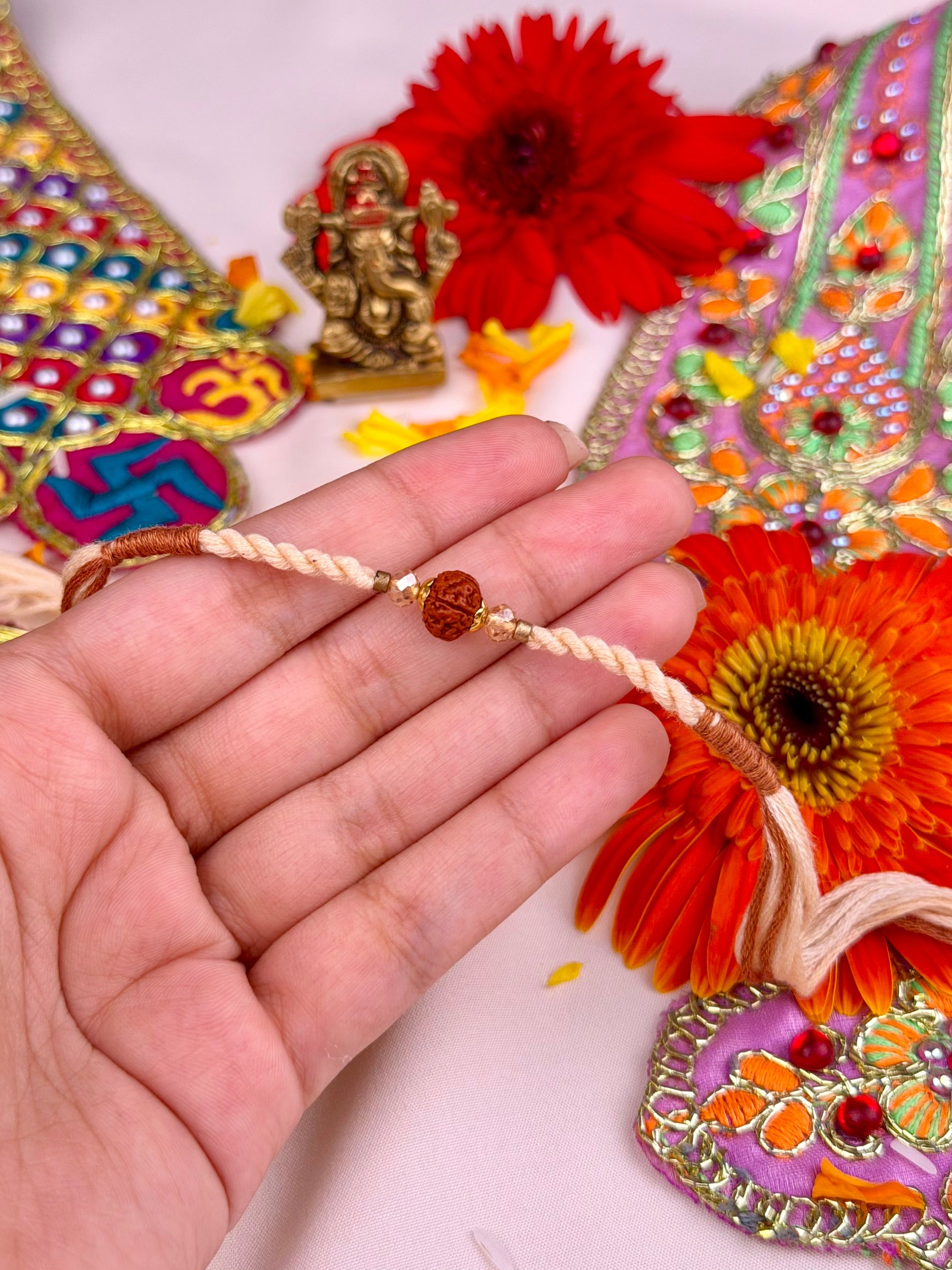Ivory Rakhi worn styled with traditional outfit