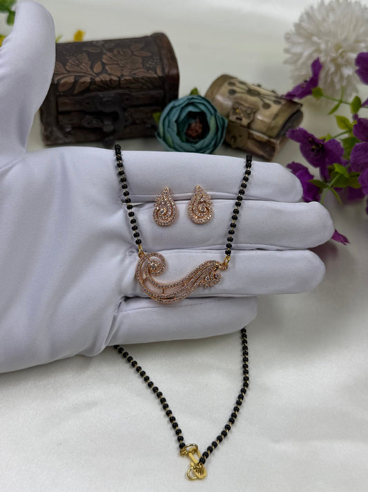 White Mangalsutra detail shot showing intricate work