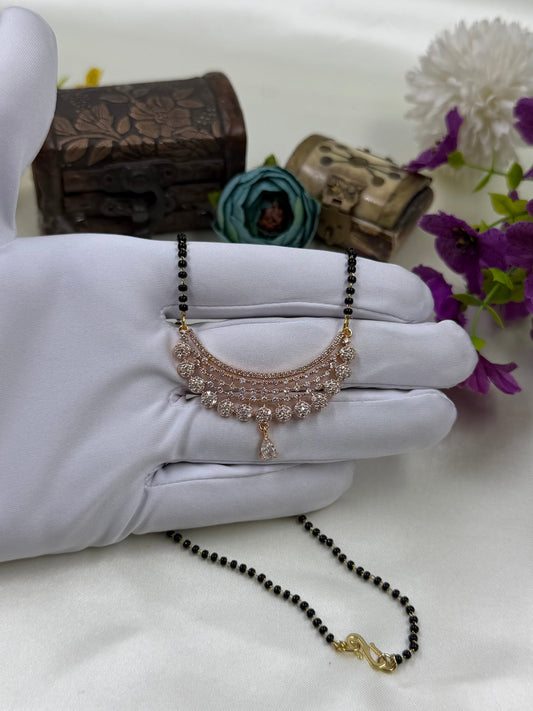 White Mangalsutra detail shot showing intricate work