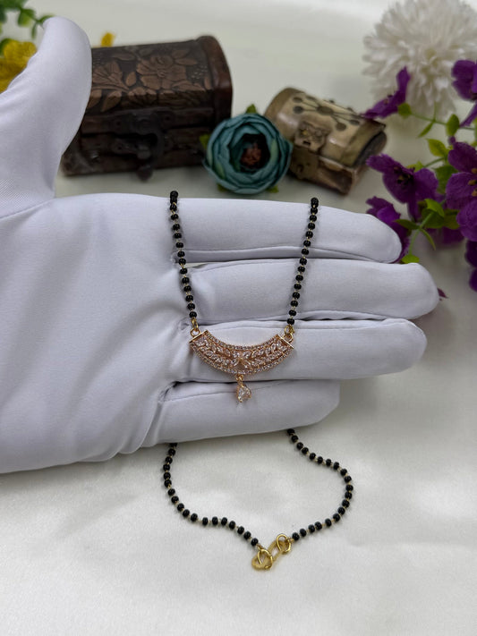 White Mangalsutra detail shot showing intricate work