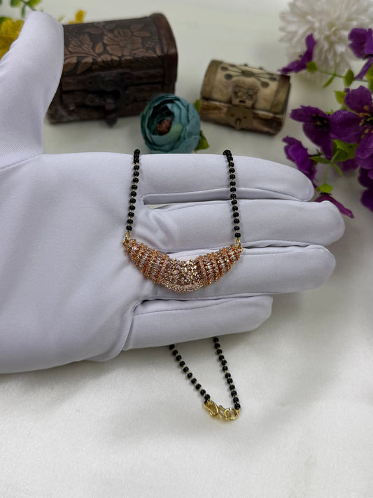 White Mangalsutra detail shot showing intricate work