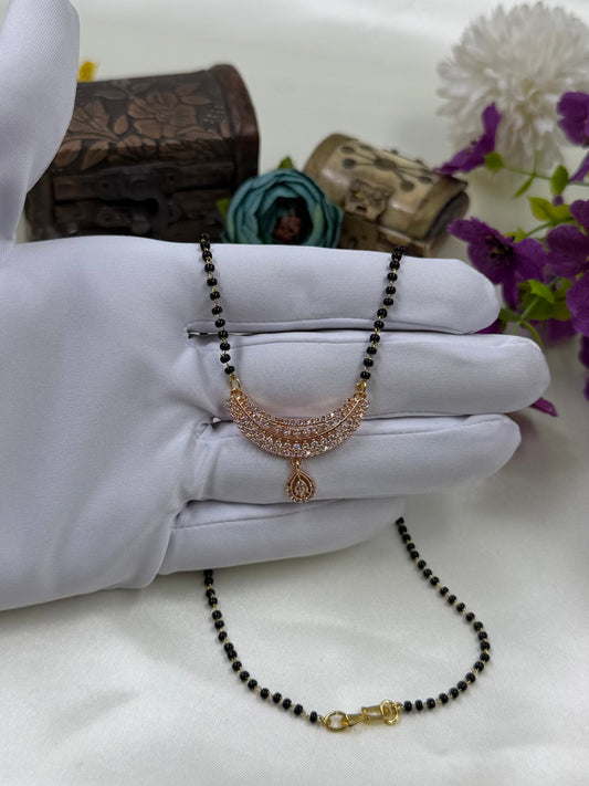 White Mangalsutra detail shot showing intricate work