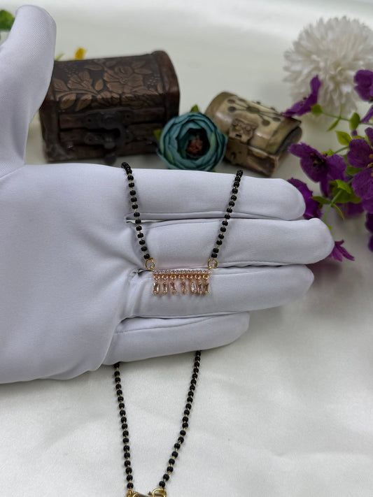 White Mangalsutra detail shot showing intricate work
