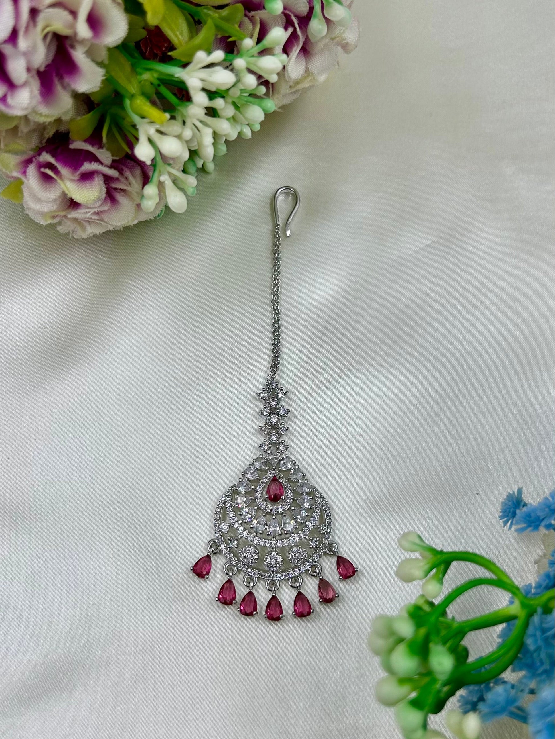 Green Maang Tikka detail shot showing American Diamond work