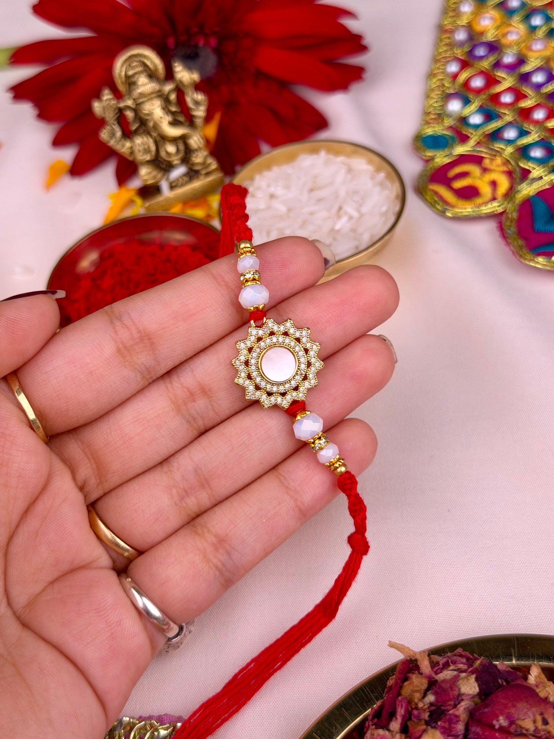 White Rakhi worn styled with traditional outfit