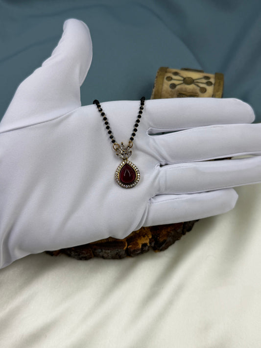 Ruby Mangalsutra detail shot showing Victorian work
