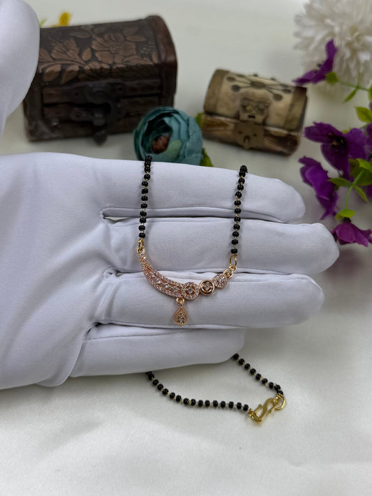 White Mangalsutra detail shot showing intricate work
