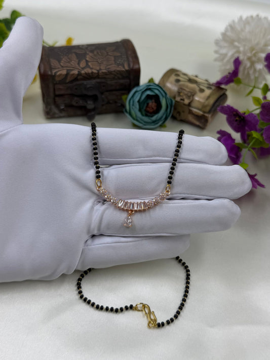 White Mangalsutra detail shot showing intricate work
