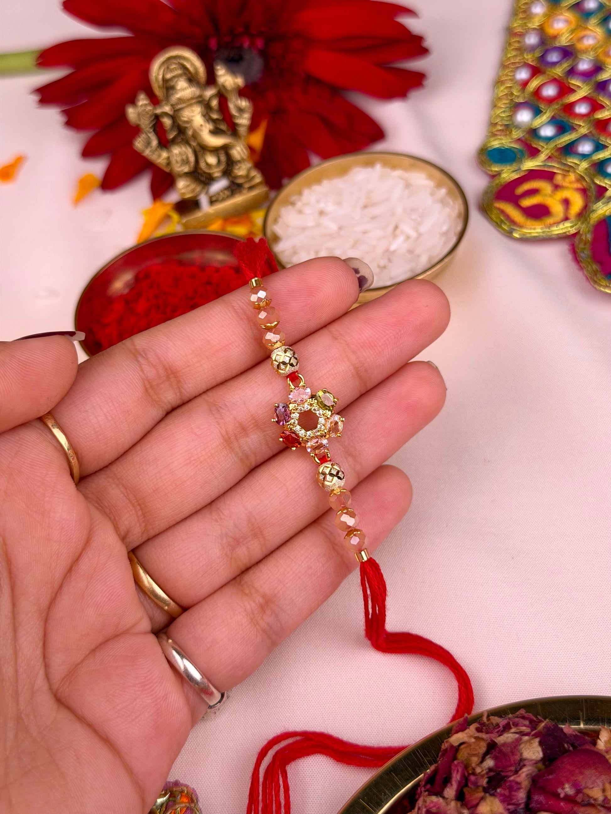 Sparkling Rakhi worn styled with traditional outfit