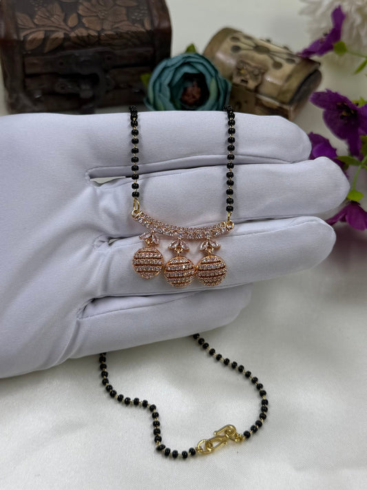 White Mangalsutra detail shot showing intricate work