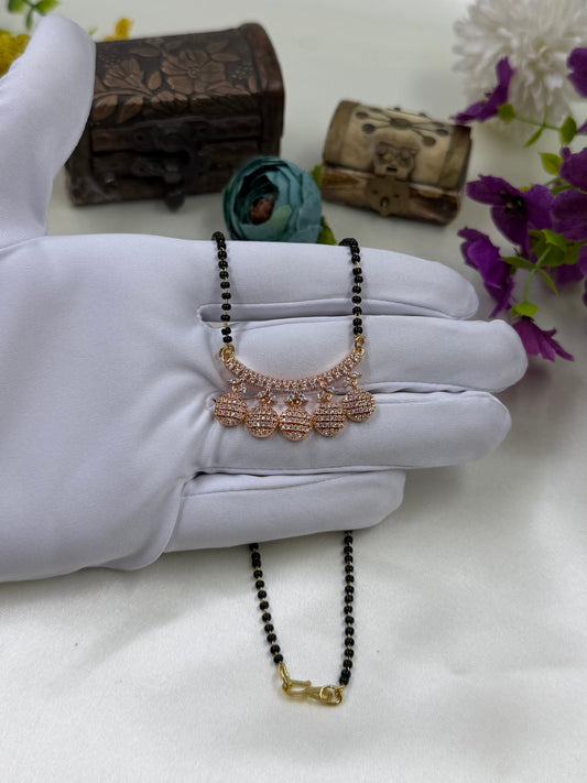 White Mangalsutra detail shot showing intricate work