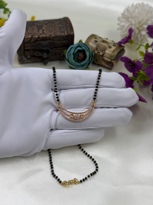 White Mangalsutra detail shot showing intricate work
