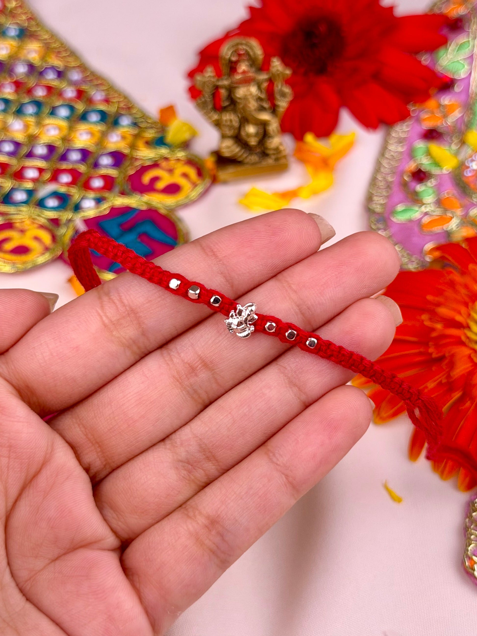 Golden Rakhi full product photo on plain background