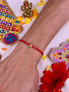 Golden Rakhi worn styled with traditional outfit