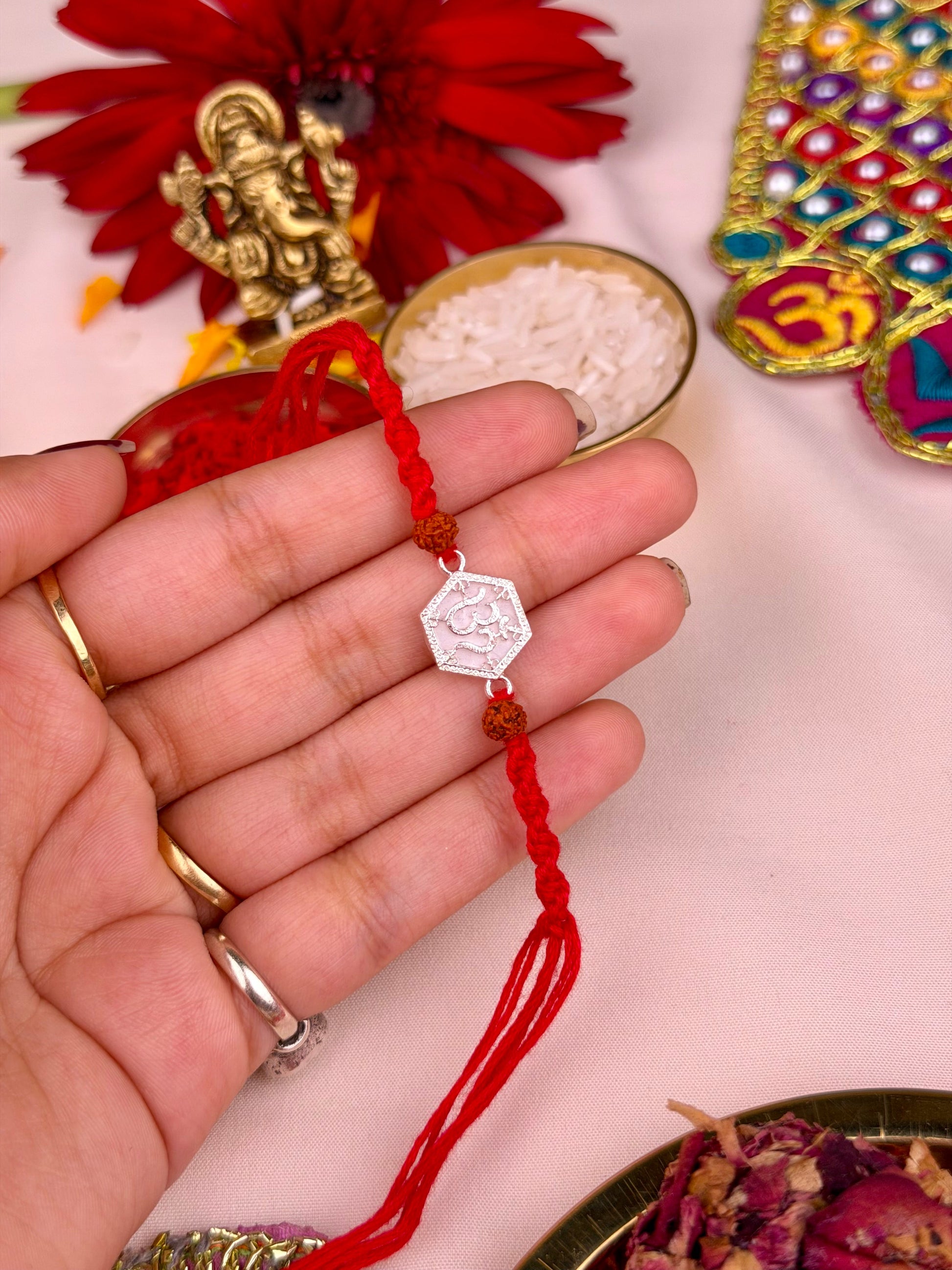 Om Rakhi worn styled with traditional outfit