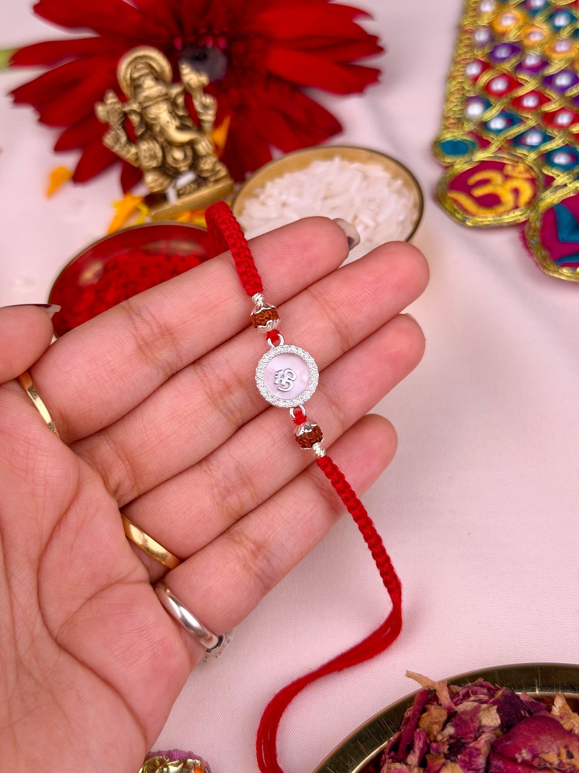 Om Rakhi worn styled with traditional outfit