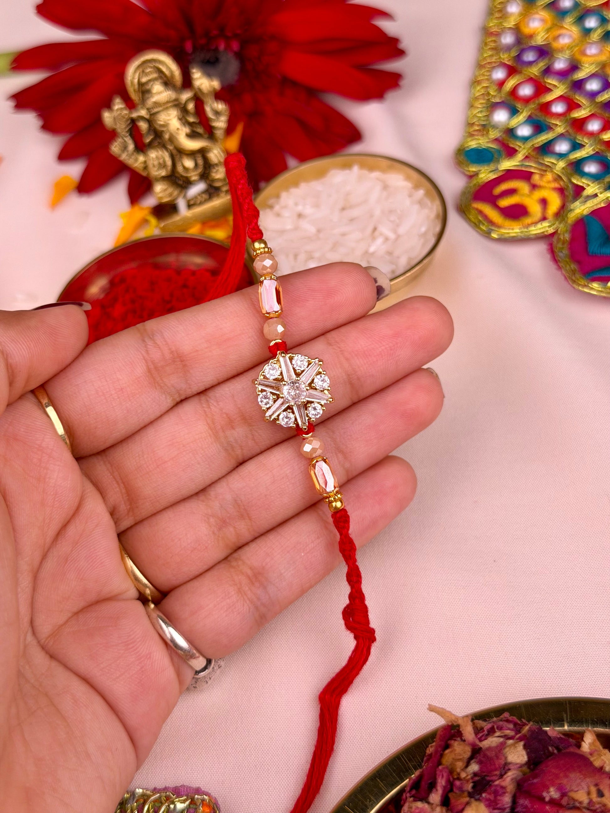 Luxe Rakhi worn styled with traditional outfit