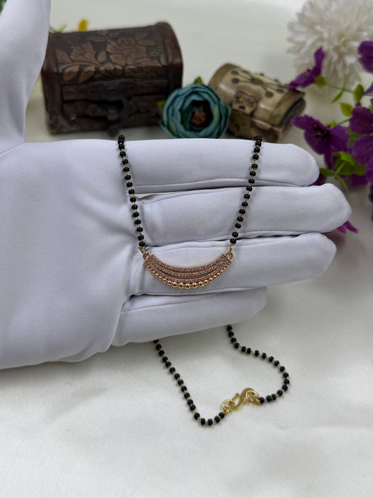 White Mangalsutra detail shot showing intricate work
