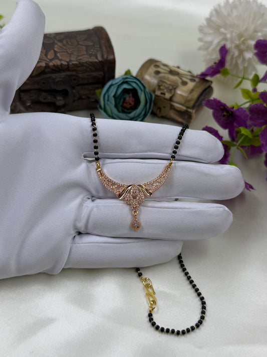 White Mangalsutra detail shot showing intricate work