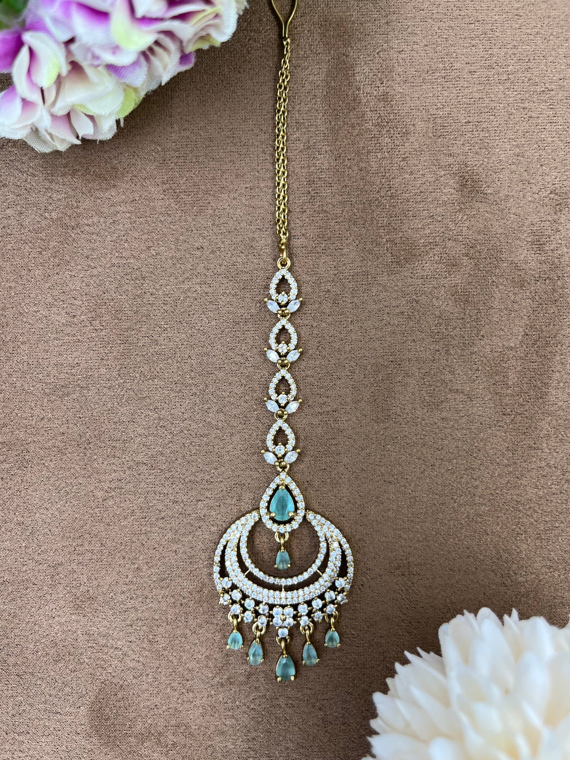 Green Jewellery detail shot showing American Diamond work